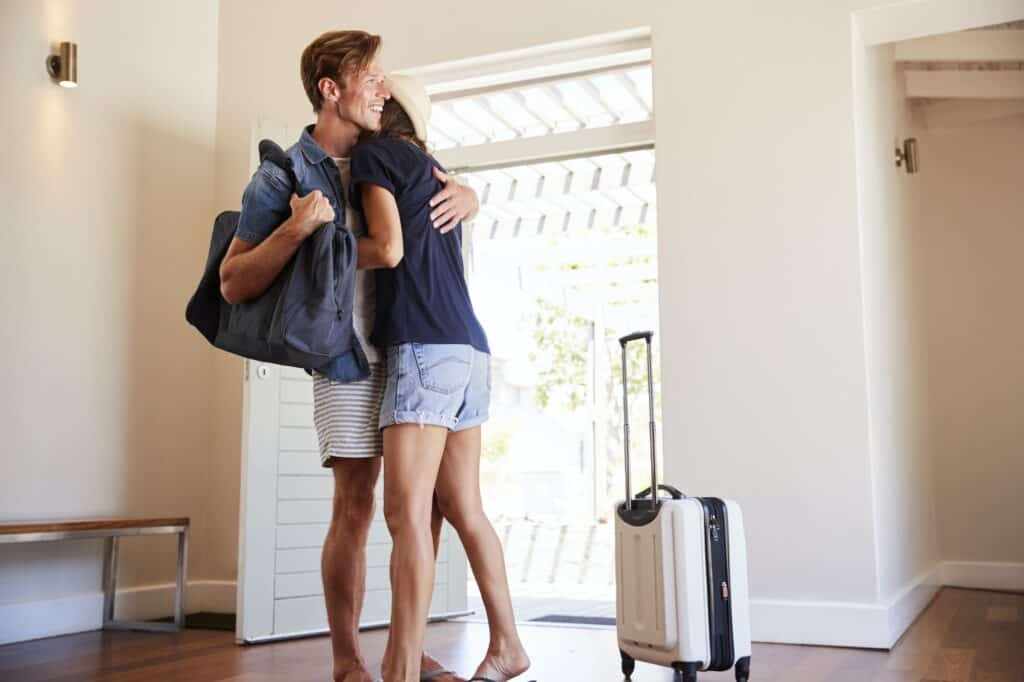 Couple Arriving At Summer Vacation Home
